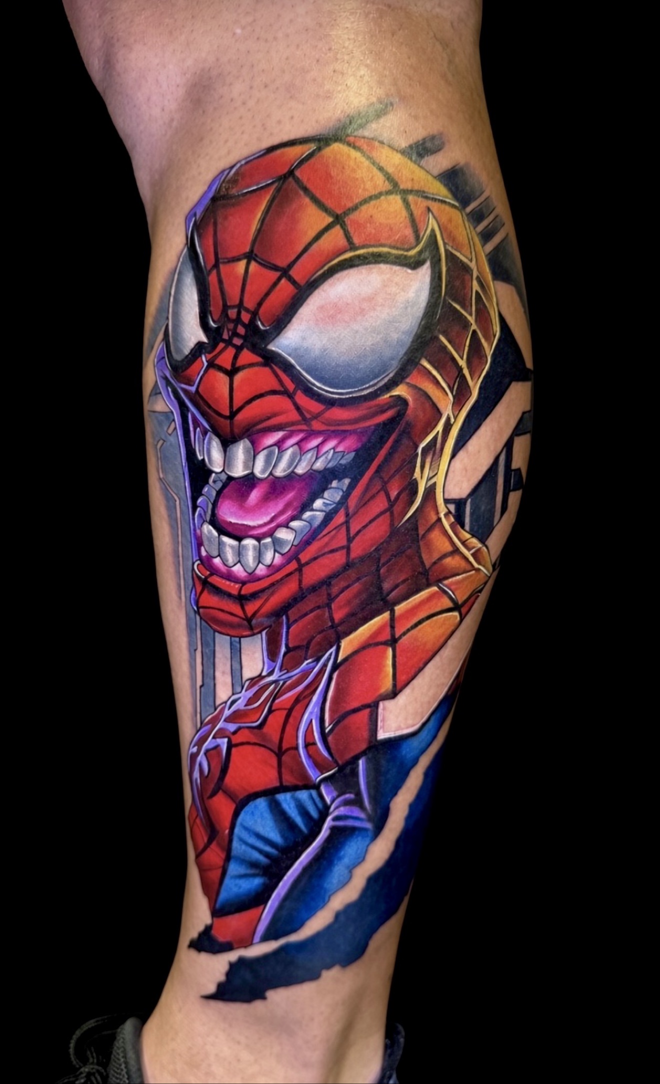 Spider-Man Venom-style color calf tattoo by Jorge Moreira at Moreira Ink Tattoo Shop, Lake Alfred FL