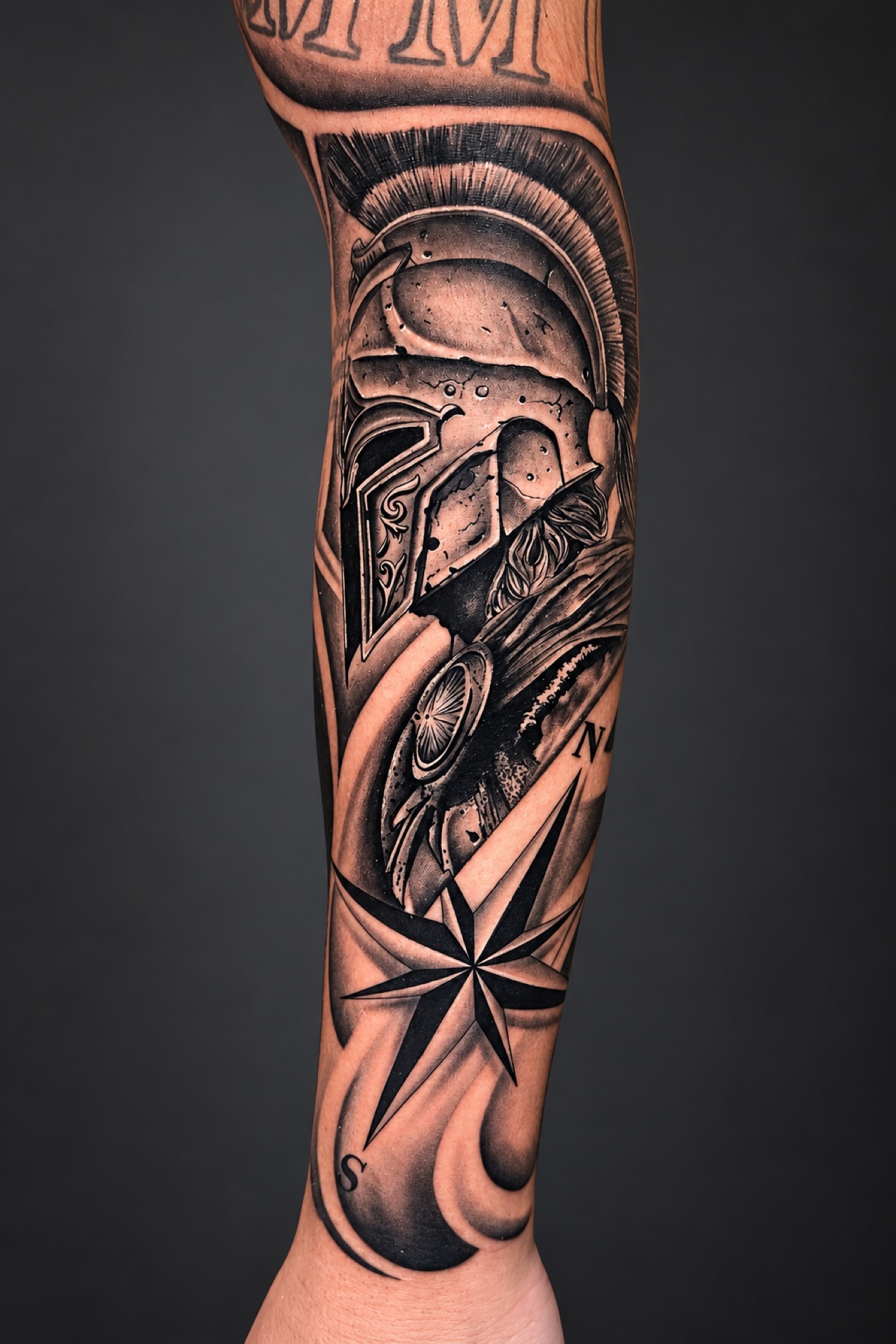 Black and grey spartan with compass tattoo by Reynier Oliva