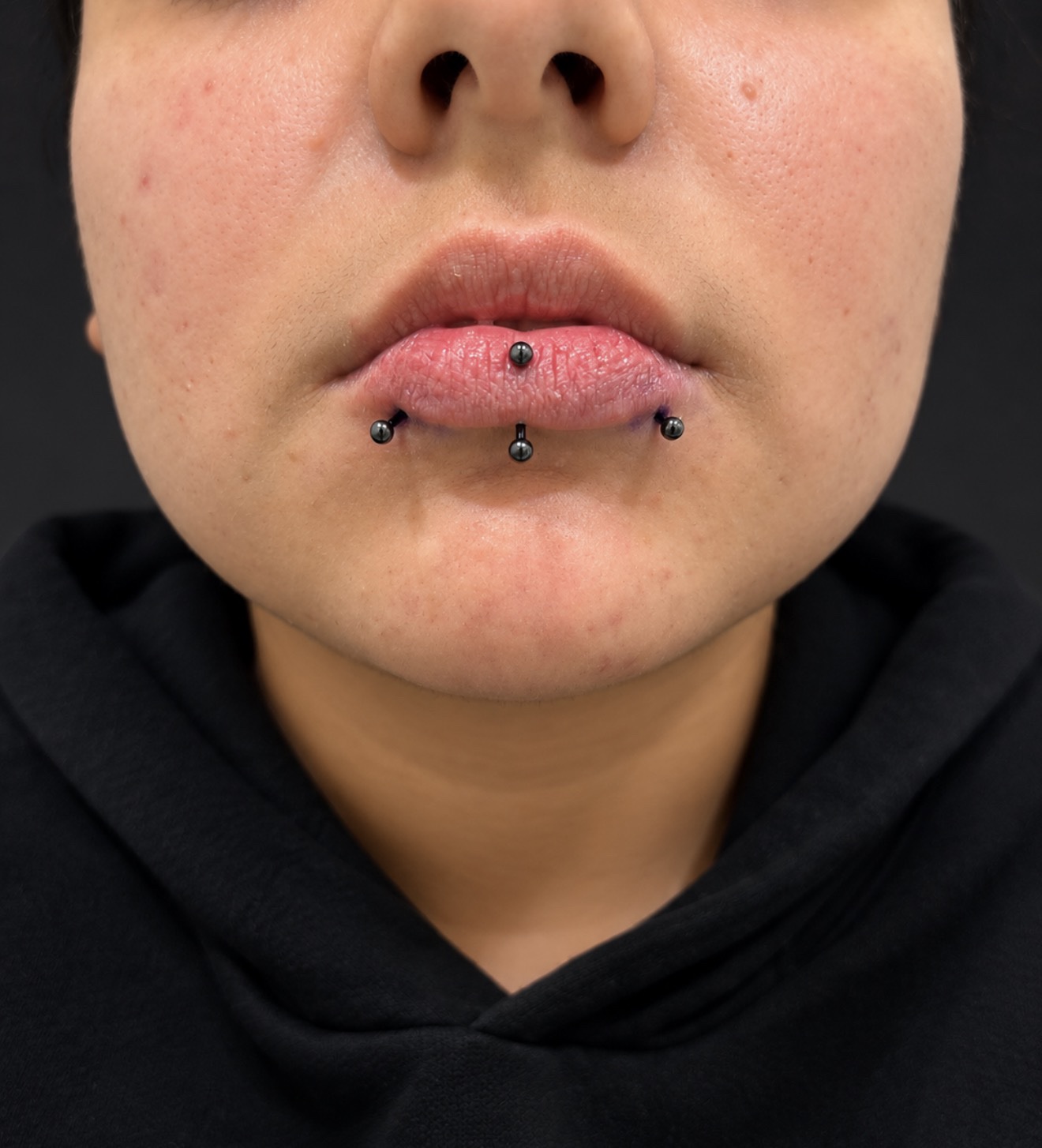 Lip piercing work by Megan Cooper