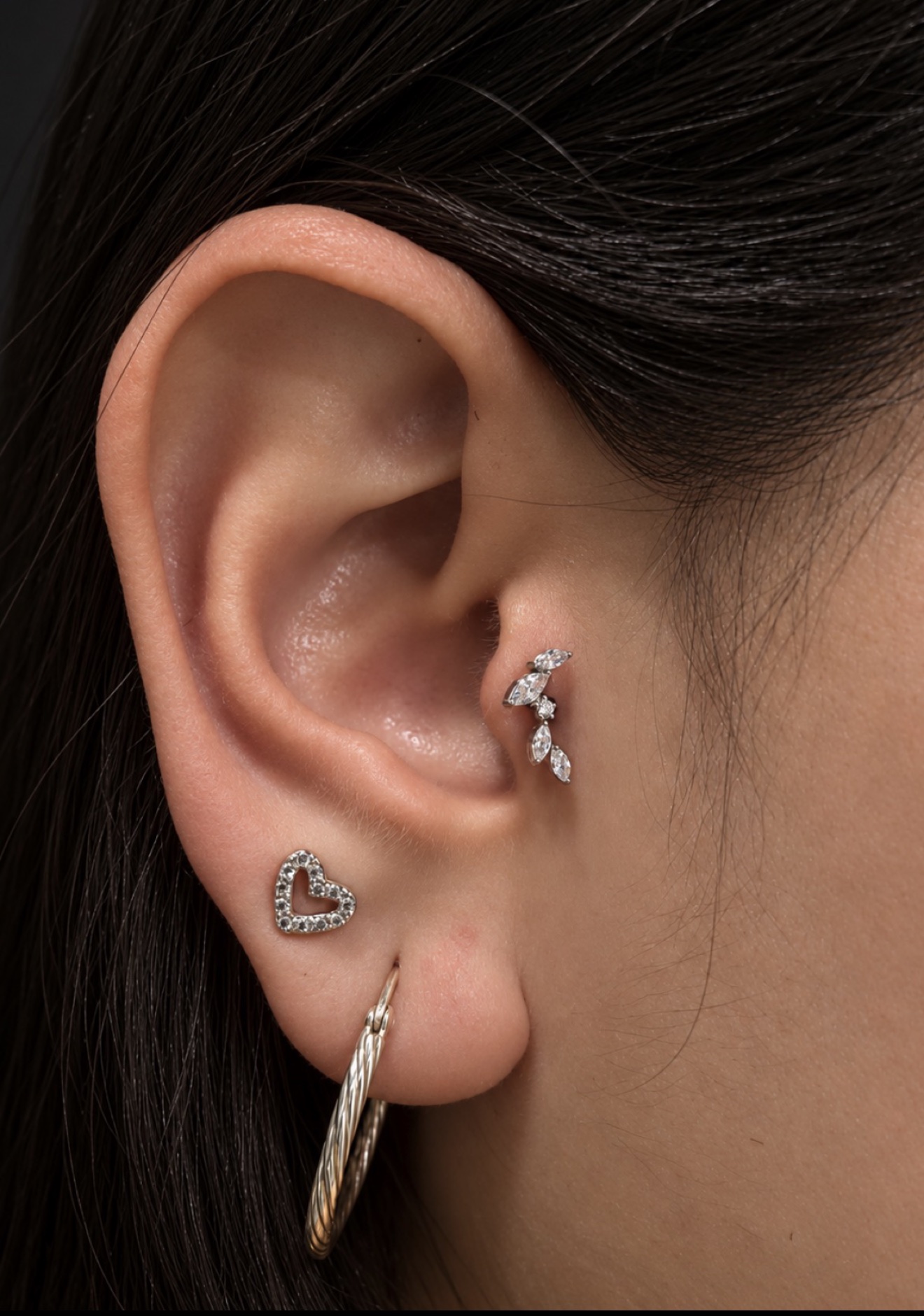 Ear tragus piercing with heart jewelry by Megan Cooper